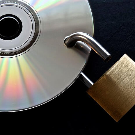 Compact disk with padlock